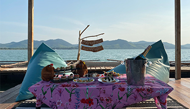 Enjoy afternoon tea at a fish farm.